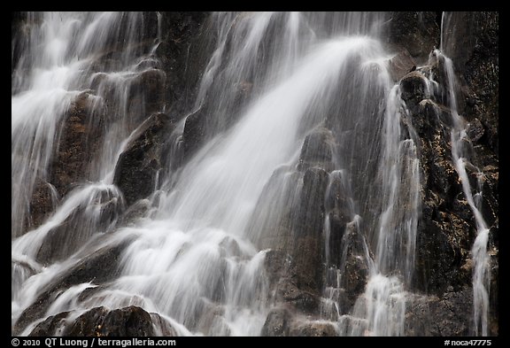 Water falling over volcanic rock, North Cascades National Park. Washington, USA.