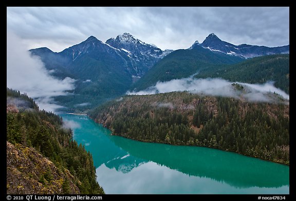 Colonial Peak and Pyramid Peak above Diablo Lake on rainy evening, North Cascades National Park Service Complex. Washington, USA.