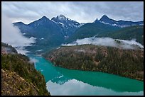 Colonial Peak and Pyramid Peak above Diablo Lake on rainy evening, North Cascades National Park Service Complex. Washington, USA.