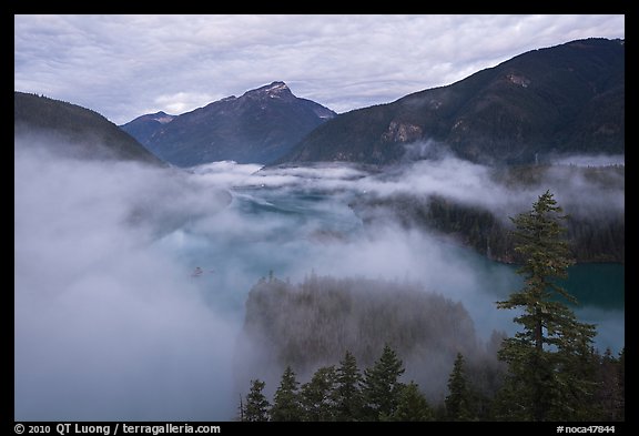 Low fog rolling over Diablo Lake, dawn, North Cascades National Park Service Complex.  (color)
