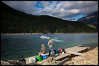 Guests waiting for ride across lake to Ross Lake resort, North Cascades National Park Service Complex.  ( color)
