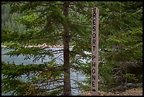 Sign pointing to phone used to call Ross Lake resort, North Cascades National Park Service Complex. Washington, USA.