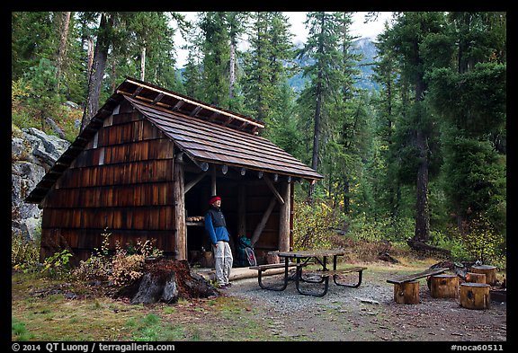 Hiker at high Bridge campground shelter, North Cascades National Park. Washington, USA.