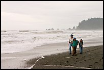 Family walking on Rialto Beach. Olympic National Park, Washington, USA.