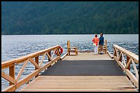 Couple on Pier, Crescent Lake. Olympic National Park, Washington, USA.