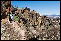 Hikers on rugged section of High Peaks trail. Pinnacles National Park, California, USA.