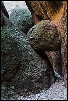 Boulder wedged in slot, Balconies Caves. Pinnacles National Park, California, USA.