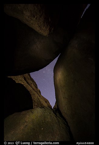 Night sky seen through opening between boulders. Pinnacles National Park, California, USA.