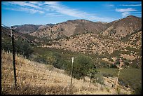 Boundary fence along steep hill. Pinnacles National Park, California, USA.