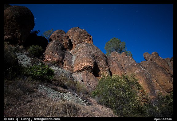 Looking up rock towers and starry night sky. Pinnacles National Park, California, USA.