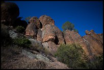 Looking up rock towers and starry night sky. Pinnacles National Park, California, USA.