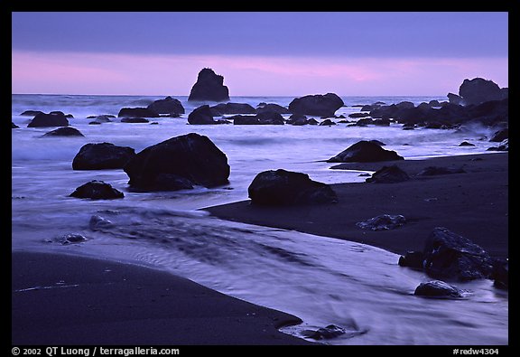 Stream, rocks, and ocean at dusk, False Klamath cove. Redwood National Park, California, USA.