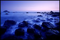 Boulders and ocean at dusk, False Klamath cove. Redwood National Park, California, USA.