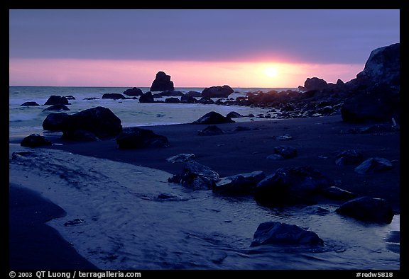 Stream reaches Pacific, False Klamath cove, sunset. Redwood National Park, California, USA.