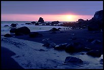 Stream reaches Pacific, False Klamath cove, sunset. Redwood National Park, California, USA. (color)