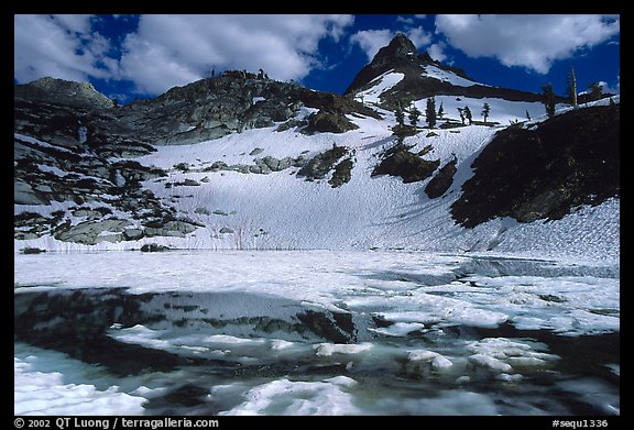 Monarch lake half-frozen in early summer. Sequoia National Park, California, USA.