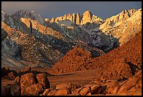 Volcanic boulders in Alabama hills and Mt Whitney, sunrise. Sequoia National Park, California, USA. (color)