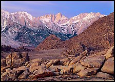 Volcanic boulders in Alabama hills and Mt Whitney, dawn. Sequoia National Park, California, USA.