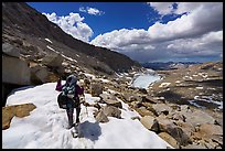 Backpacker crossing snowy section of the John Muir Trail below Forester Pass, Sequoia National Park. California ( color)