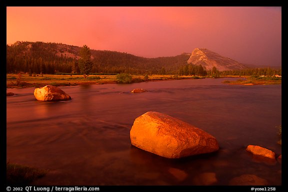 Tuolumne Meadows, Lembert Dome, and rainbow, storm clearing at sunset. Yosemite National Park, California, USA.