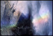 Rainbow, water, and rock at  base of Upper Yosemite Falls. Yosemite National Park, California, USA.