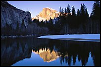 Half-Dome reflected in Merced River near Sentinel Bridge, sunset. Yosemite National Park, California, USA.