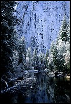 Cathedral rocks with fresh snow reflected in Merced River, early morning. Yosemite National Park, California, USA. (color)