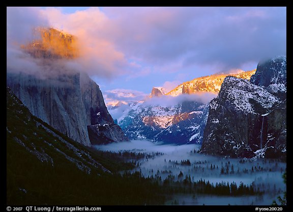 View with fog in valley and peaks lighted by sunset,  winter. Yosemite National Park (color)