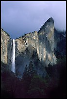 Bridalveil Falls and Leaning Tower, stormy sky. Yosemite National Park, California, USA.