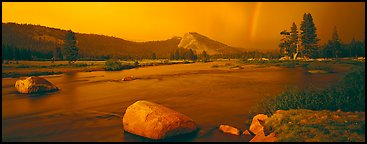 Tuolumne Meadows, Lembert Dome, and rainbow, storm clearing at sunset. Yosemite National Park, California, USA.