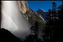 Upper Yosemite Falls with double moonbow and Half-Dome. Yosemite National Park, California, USA.