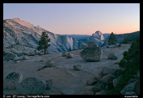 Glacial erratic boulders, Clouds Rest, and Half-Dome from Olmstedt Point, dusk. Yosemite National Park, California, USA.