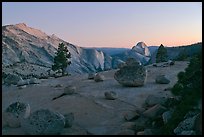 Glacial erratic boulders, Clouds Rest, and Half-Dome from Olmstedt Point, dusk. Yosemite National Park, California, USA.