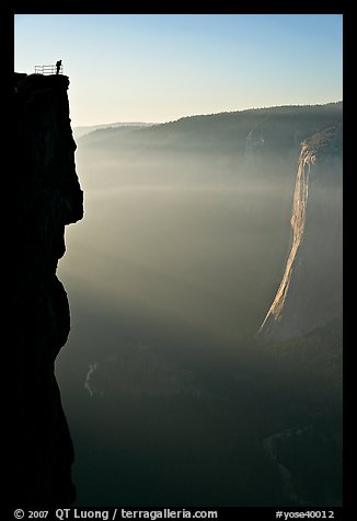 Hiker surveying Yosemite Valley from Profile Cliff overlook. Yosemite National Park, California, USA.