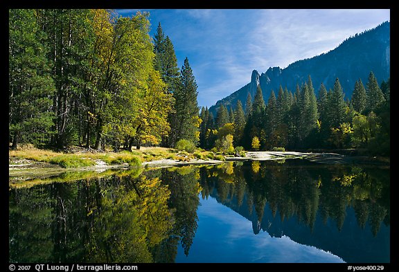 Merced River with fall colors and Sentinel Rocks reflections. Yosemite National Park, California, USA.