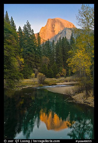 Half Dome reflected in Merced River at sunset. Yosemite National Park, California, USA.