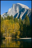 Banks of  Merced River with hiker below Half-Dome. Yosemite National Park, California, USA. (color)