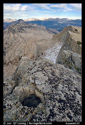 Frozen pot hole and summit cliffs, Mount Hoffman. Yosemite National Park, California, USA.