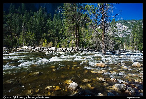 Wide stretch of Merced River in spring, Lower Merced Canyon. Yosemite National Park, California, USA.