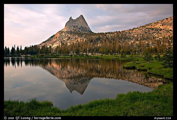 Cathedral Peak reflected in upper Cathedral Lake, late afternoon. Yosemite National Park, California, USA.