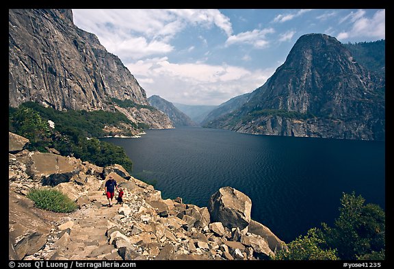 Father hiking with boy next to Hetch Hetchy reservoir. Yosemite National Park (color)