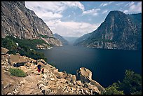 Father hiking with boy next to Hetch Hetchy reservoir. Yosemite National Park, California, USA.