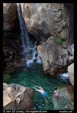 Swimmers in a pool at the base of Wapama falls, Hetch Hetchy. Yosemite National Park (color)