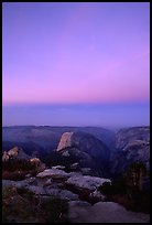 Half-Dome and Yosemite Valley under  pink hues of dawn sky. Yosemite National Park, California, USA.