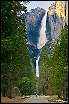 Tourists on path dwarfed by Upper and Lower Yosemite Falls. Yosemite National Park, California, USA. (color)