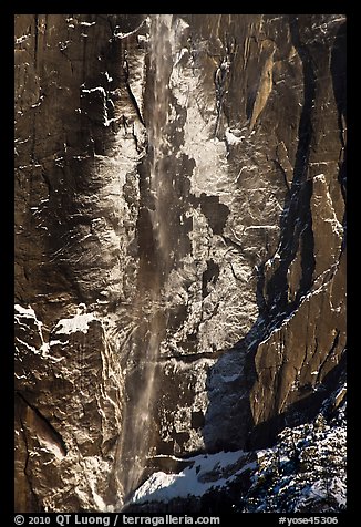 Upper Yosemite Falls and icy rock wall. Yosemite National Park, California, USA.