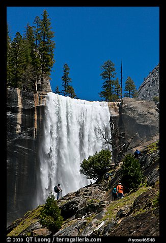 Hikers standing on Mist Trail below Vernal Fall. Yosemite National Park, California, USA.