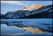 Tenaya Peak reflected in partly iced Tenaya Lake. Yosemite National Park, California, USA. (color)