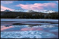 Peaks reflected in snow melt pool, Twolumne Meadows, sunset. Yosemite National Park, California, USA. (color)