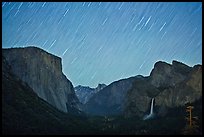 Yosemite Valley by night with star trails. Yosemite National Park, California, USA.